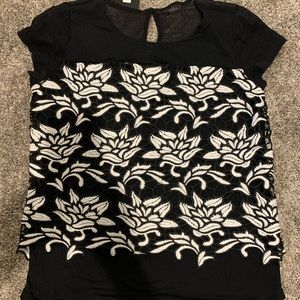 INC black and white knit top with overlay.